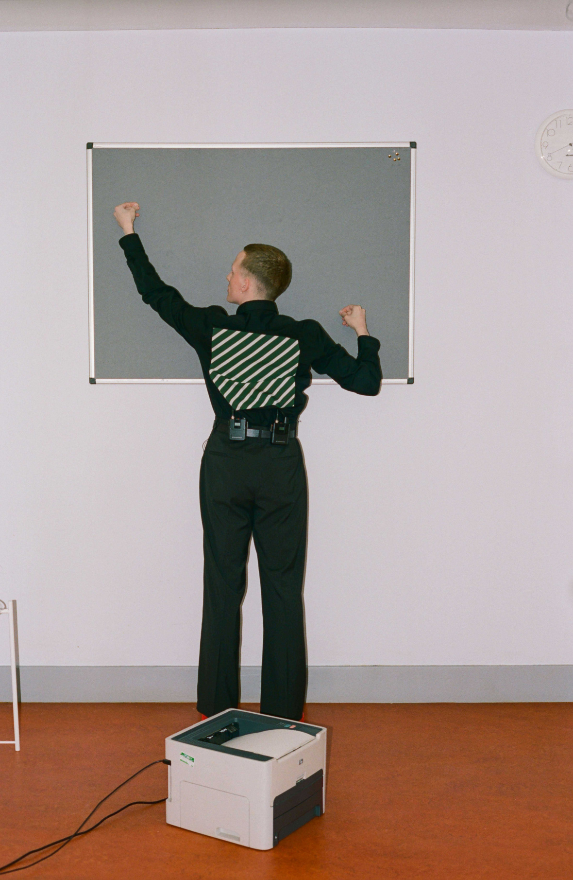 Shirt by RAF SIMONS, Trousers by PAUL SMITH, Belt — Stylist’s own, Boots by CAMPER LAB