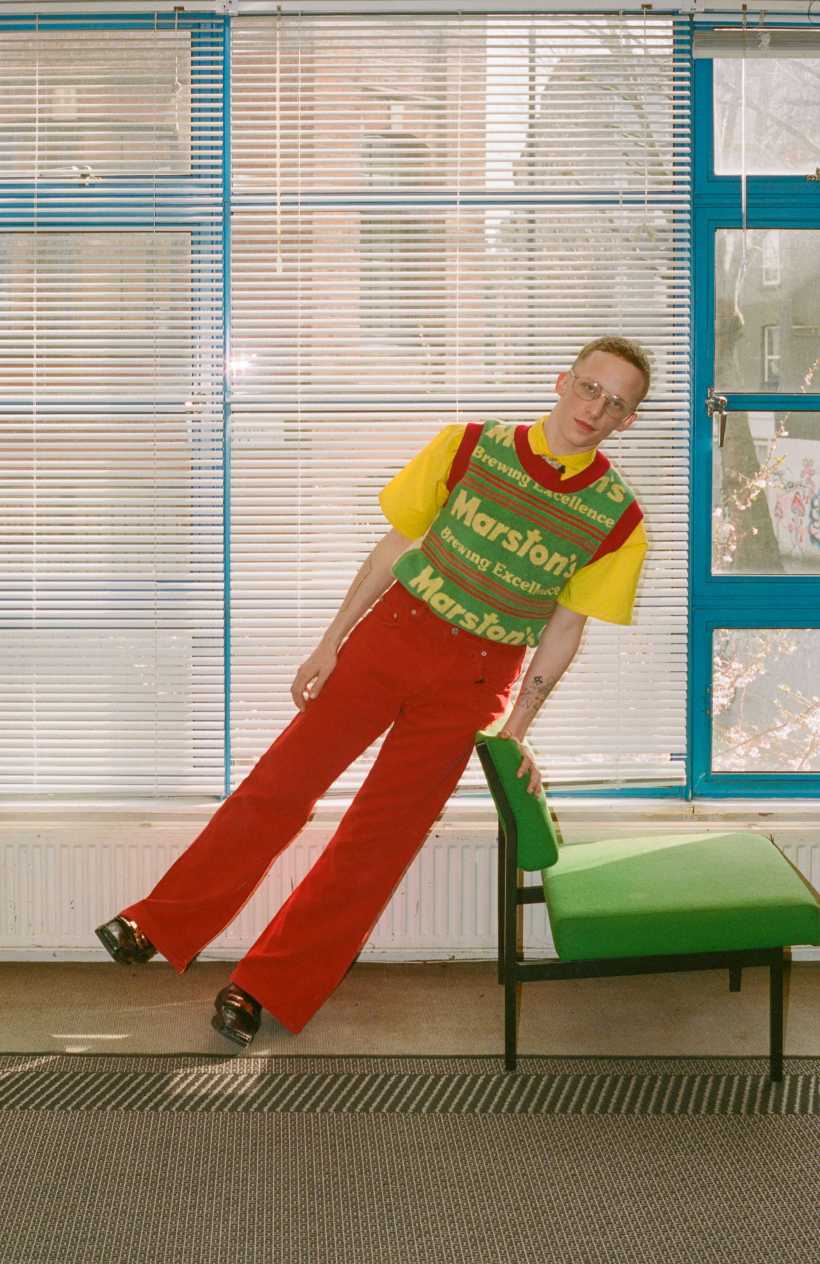 Vintage shirt and tie from CONTEMPORARY WARDROBE, Sweater by ADAM JONES, Trousers by PAUL SMITH, Socks — Stylist's own, Shoes by MARTINE ROSE, Glasses by LINDA FARROW